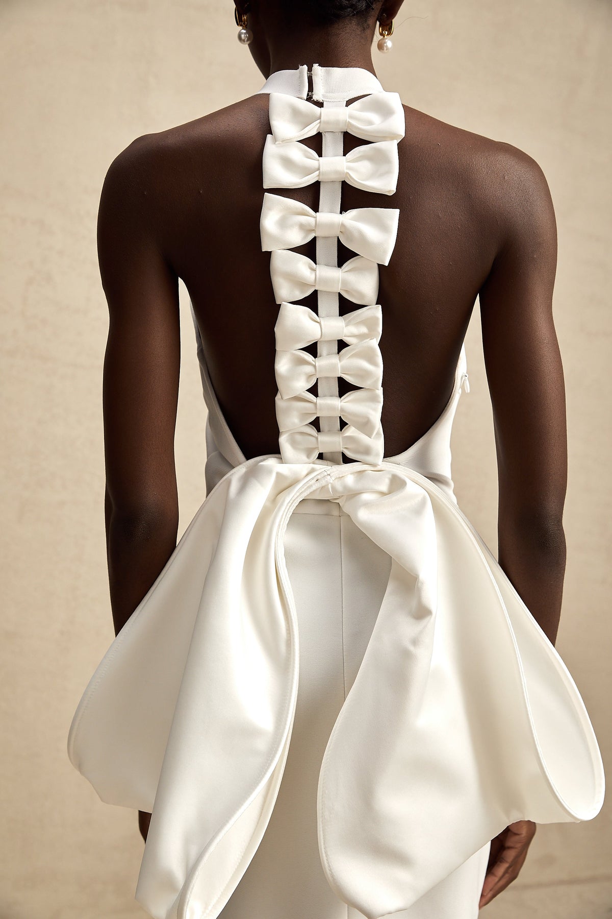 Capucine white oversize-bow bandage dress