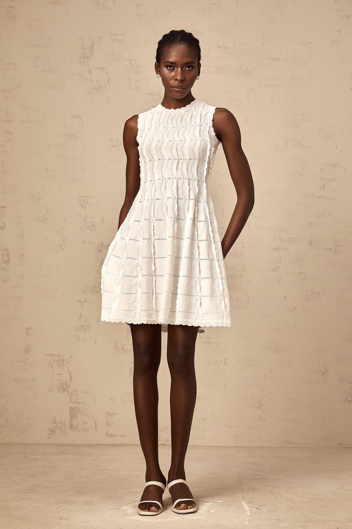 Esmée white ruffled sleeveless knit mini dress