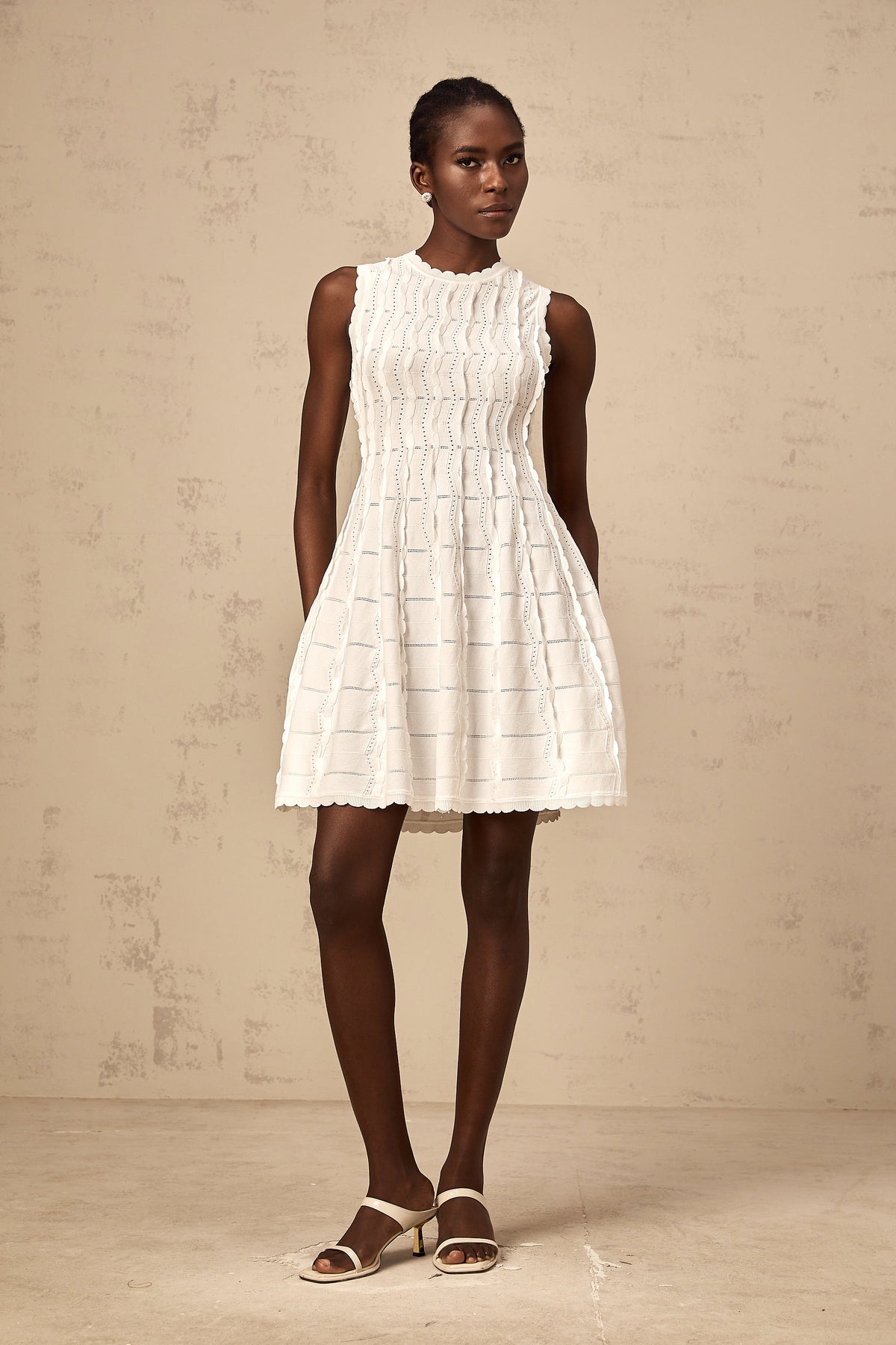 Esmée white ruffled sleeveless knit mini dress