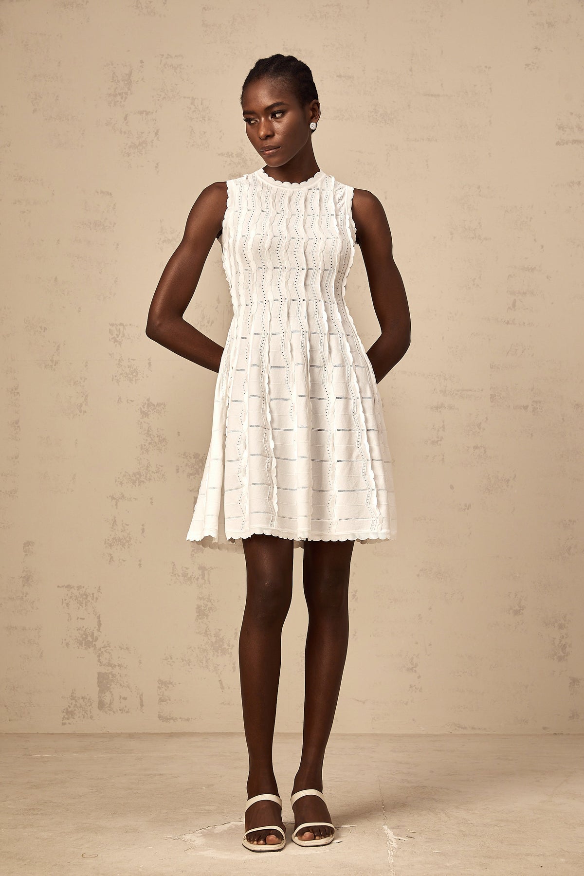 Esmée white ruffled sleeveless knit mini dress