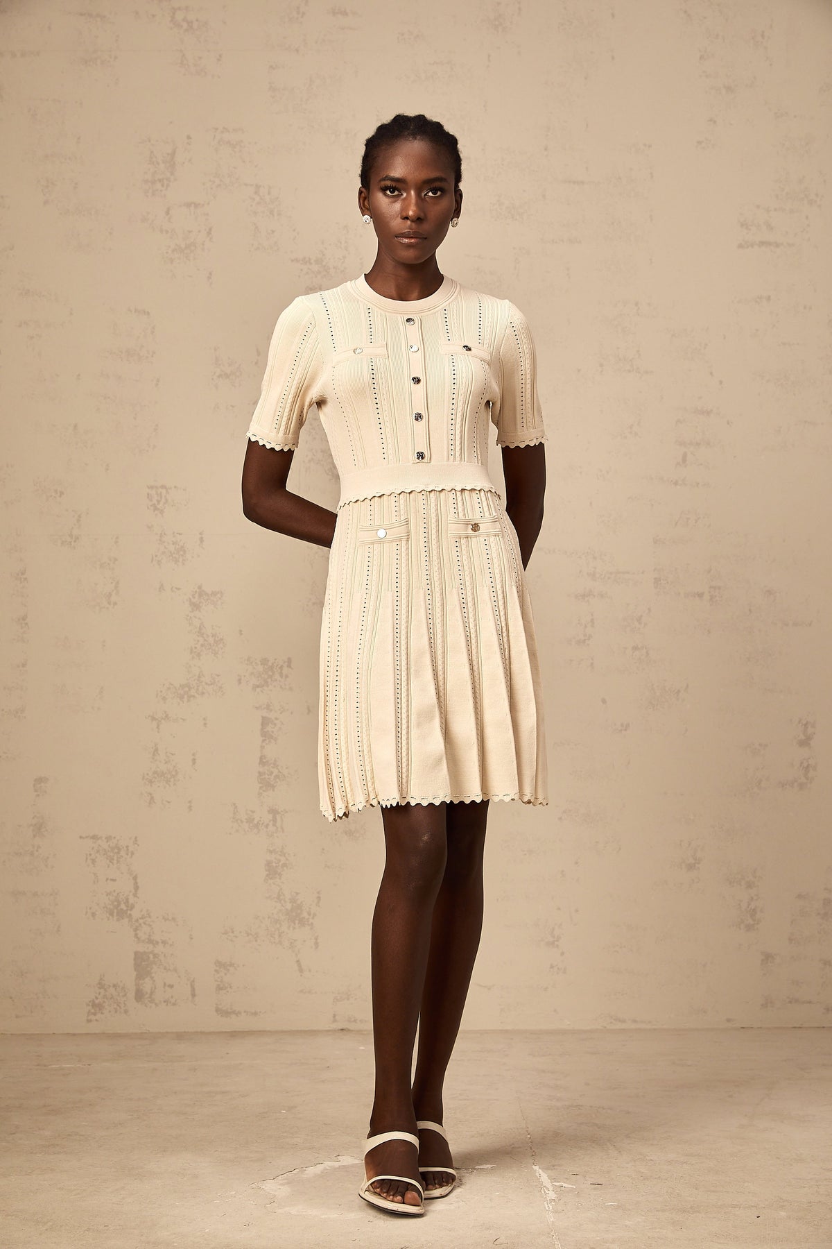 Amélie neutrals pointelle-trim pleated knit mini dress