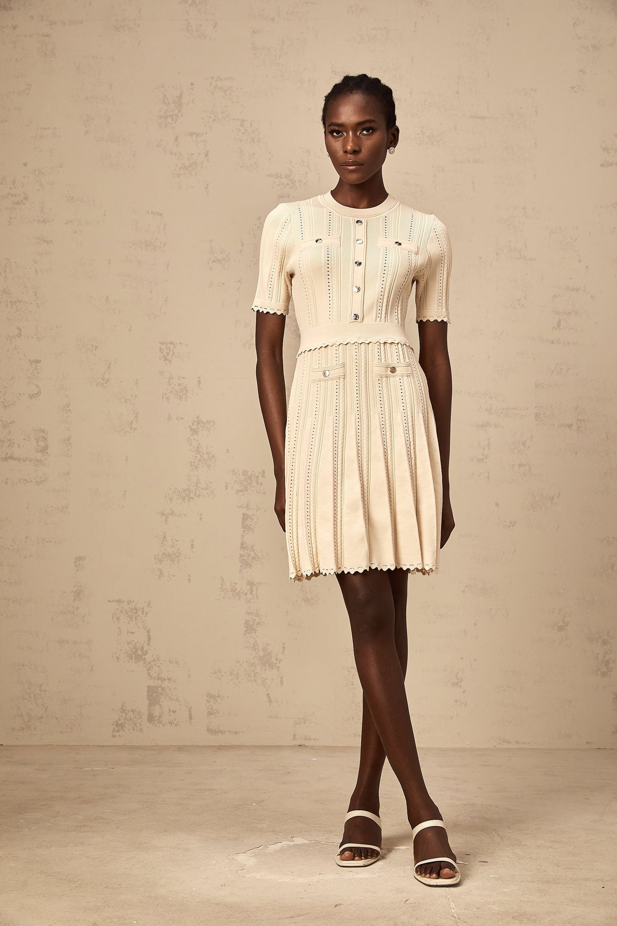 Amélie neutrals pointelle-trim pleated knit mini dress