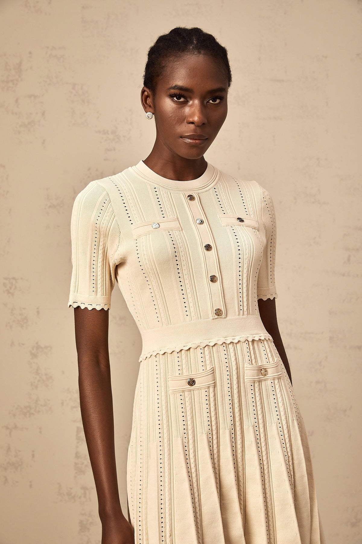 Amélie neutrals pointelle-trim pleated knit mini dress