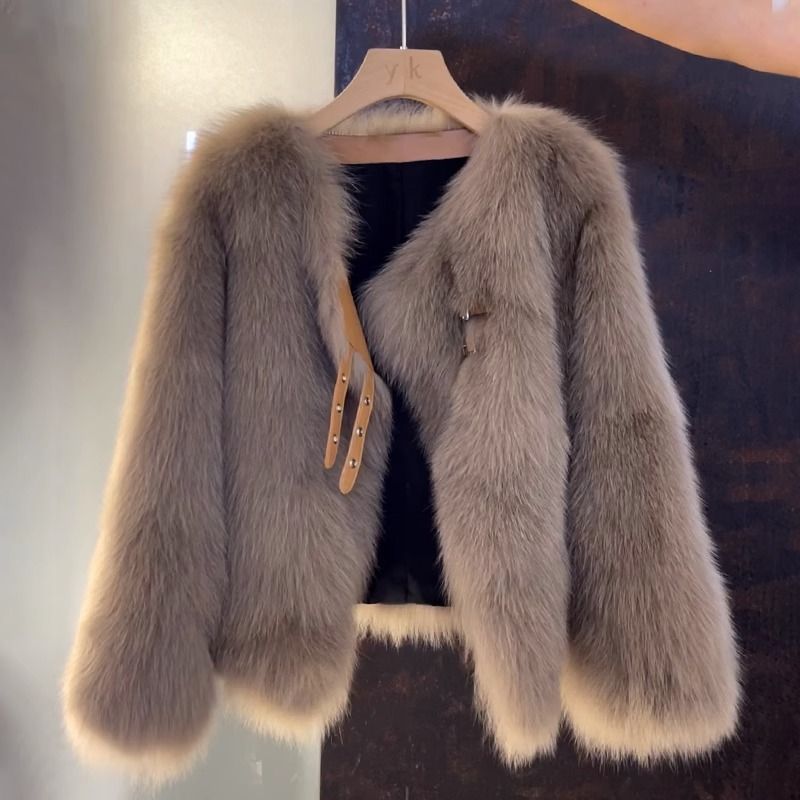 Vogue brown V-neck leather and fur coat