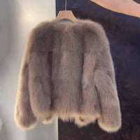 Vogue brown V-neck leather and fur coat