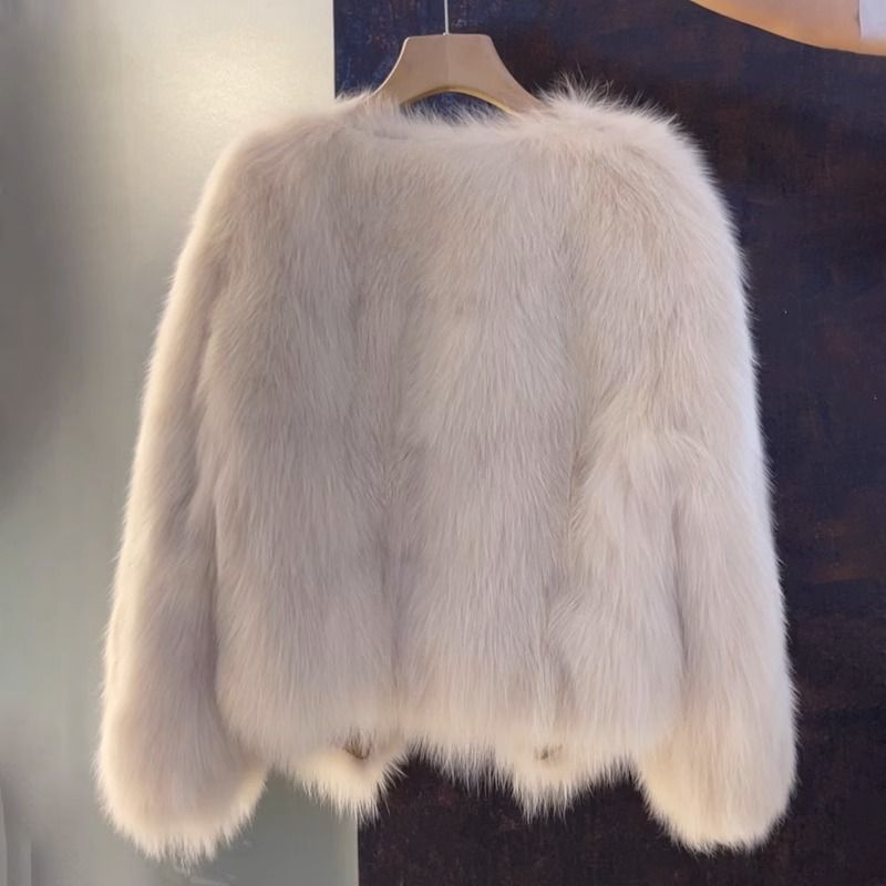 Vogue brown V-neck leather and fur coat