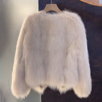 Vogue brown V-neck leather and fur coat