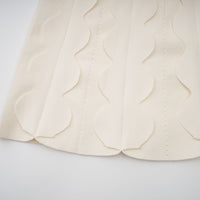 Axelle white wavy-detail sleeveless mini dress