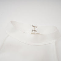 Capucine white oversize-bow bandage dress