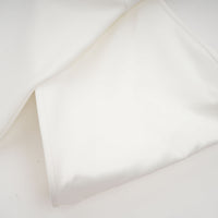 Capucine white oversize-bow bandage dress