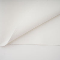 Capucine white oversize-bow bandage dress