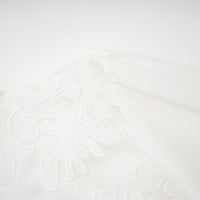 Madeleine white panelled embroidered midi dress