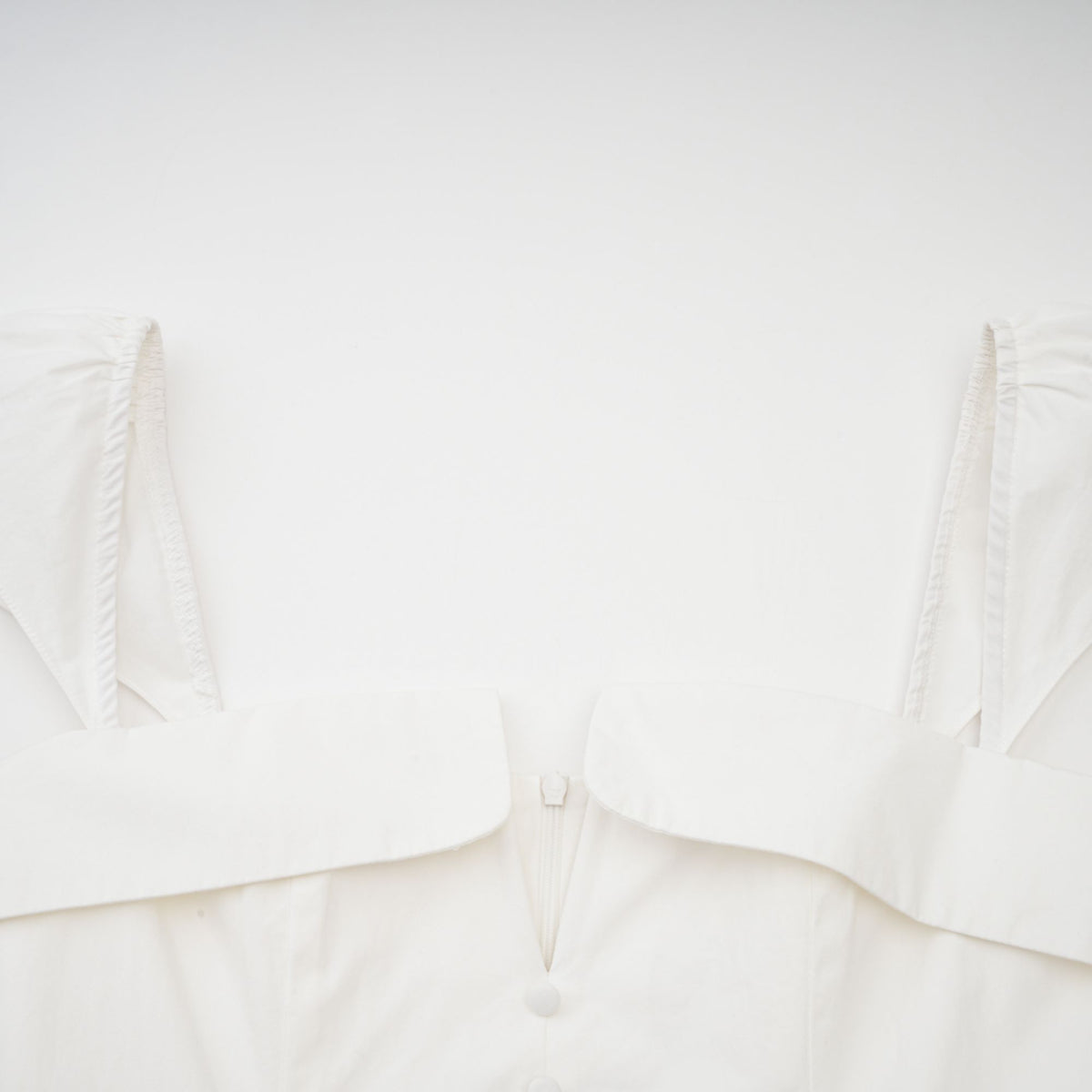 Julie white folded-neck bonded sleeveless mini dress