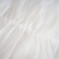 Quincie white shirred flounced mini dress